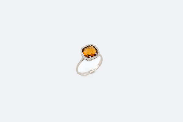 Anello in oro bianco con pietra gialla